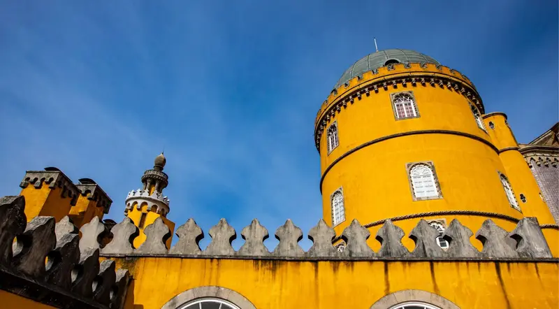 Yellow domed tower and battlements of Pena Palace in Sintra