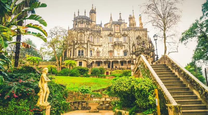 The Gothic facade and gardens of Quinta da Regaleira with its grand staircase in Sintra